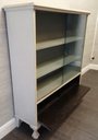 Glazed front sliding door painted bookcase