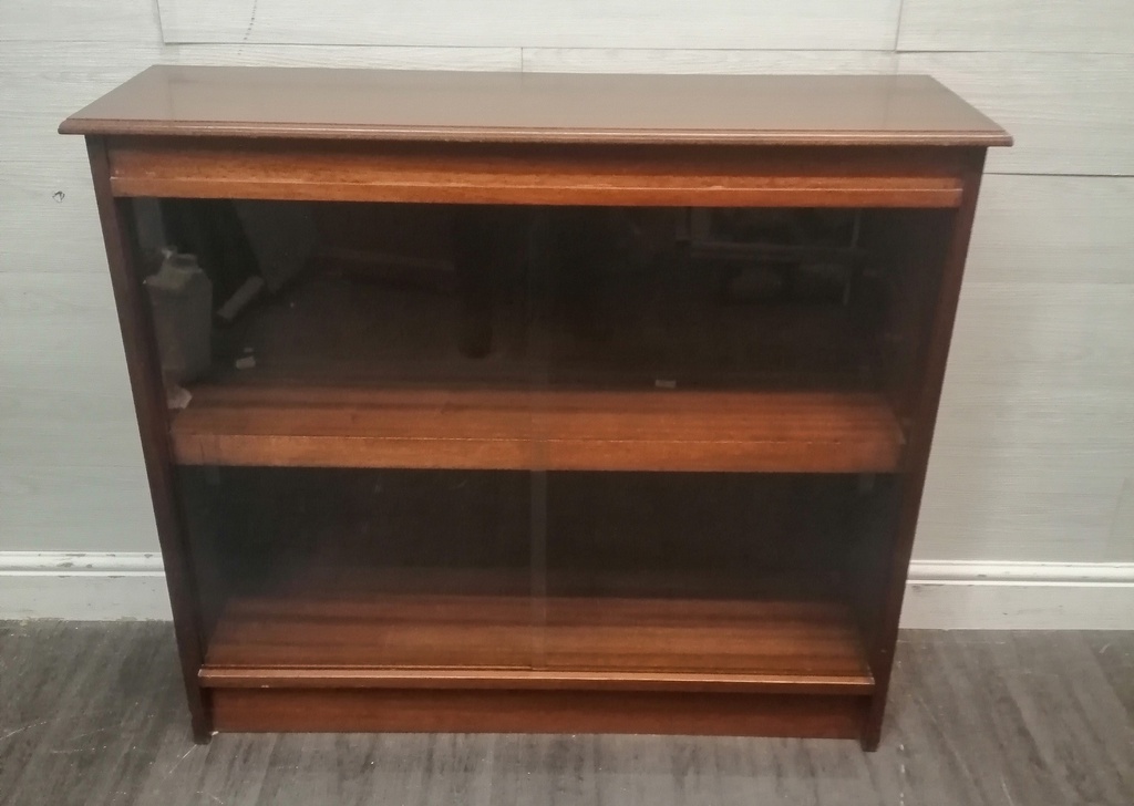 Glazed front sliding door neat bookcase