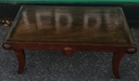 Dark wood scrolled coffee table