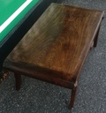 Dark wood scrolled coffee table