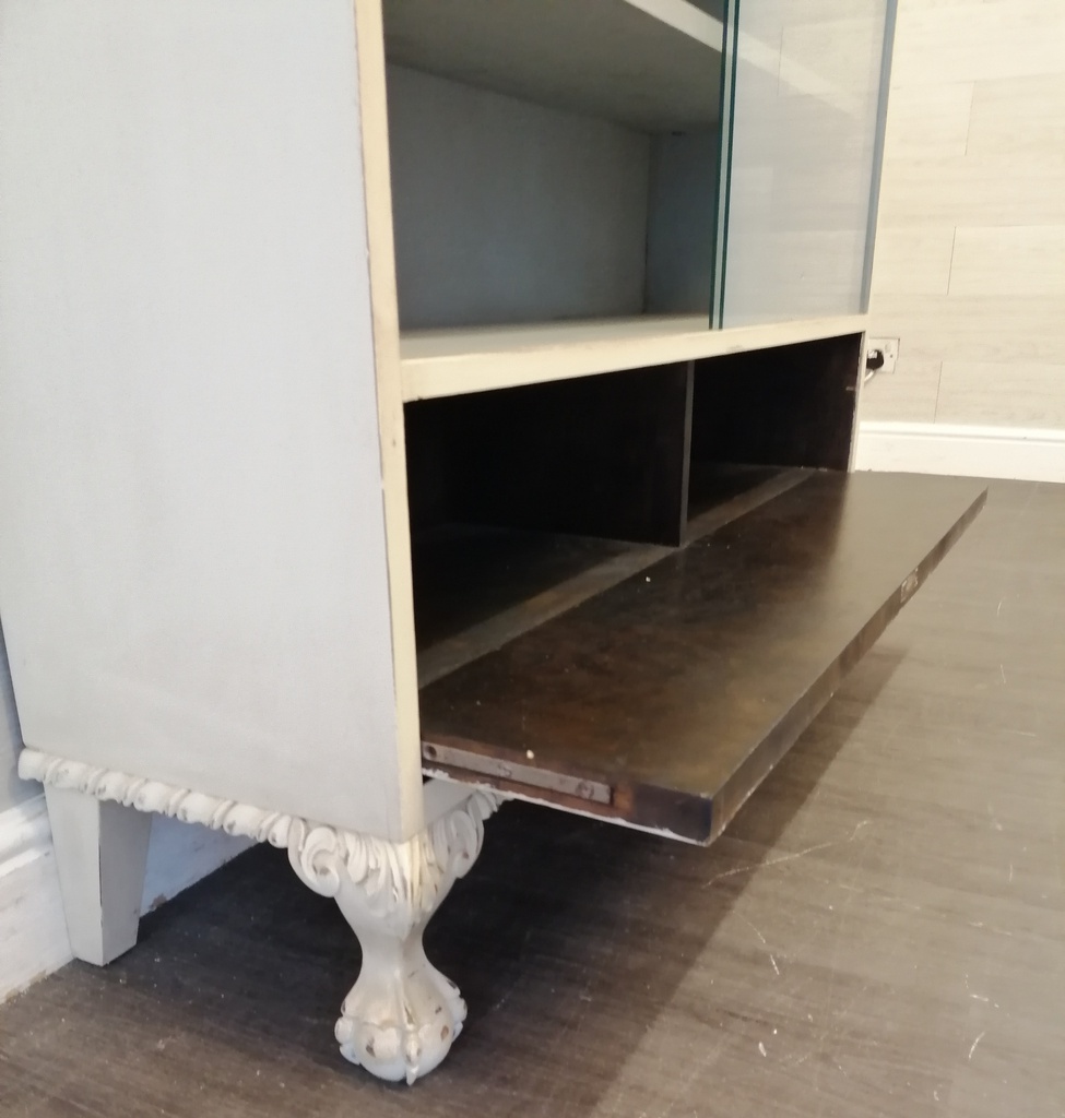 Glazed front sliding door painted bookcase