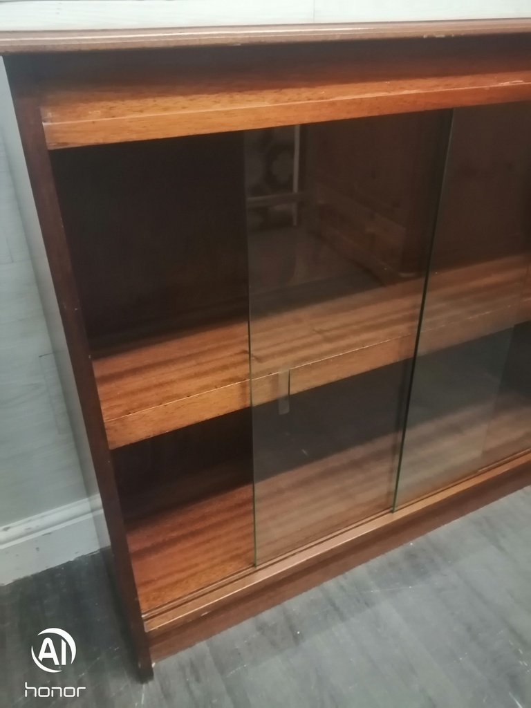 Glazed front sliding door neat bookcase